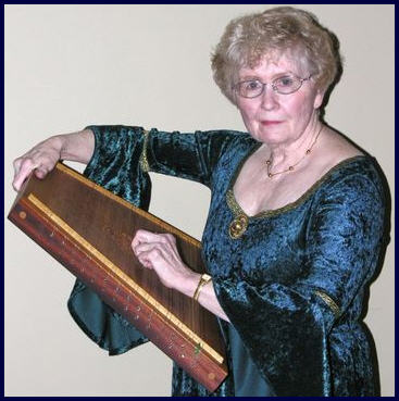 Barbara with 
		her psaltery.